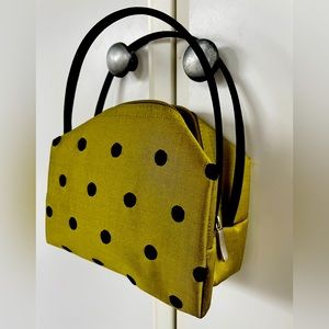 Green poke a dot hand bag